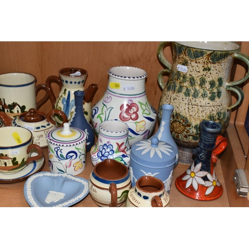 380 - A COLLECTION OF NAMED CERAMICS, comprising two Art Pottery chamber sticks, six pieces of Wedgwood bl... 