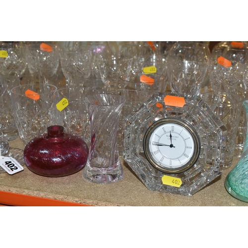 402 - A LARGE SELECTION OF GLASSWARE INCLUDING A WATERFORD CRYSTAL CLOCK, TOGETHER WITH A VARIETY OF THOMA... 