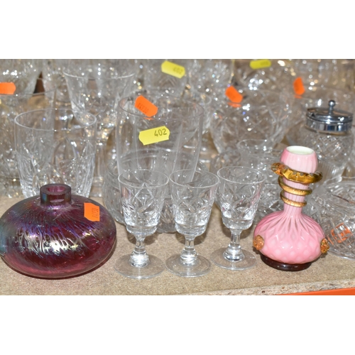 402 - A LARGE SELECTION OF GLASSWARE INCLUDING A WATERFORD CRYSTAL CLOCK, TOGETHER WITH A VARIETY OF THOMA... 