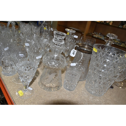 411 - A LARGE VARIETY OF CRYSTAL CUT DECANTERS, GLASSES, ETC, including two 'Royal Brierley' vases and a d... 