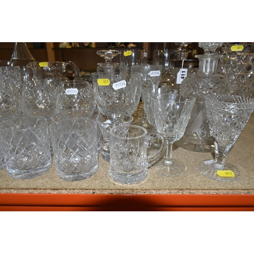 411 - A LARGE VARIETY OF CRYSTAL CUT DECANTERS, GLASSES, ETC, including two 'Royal Brierley' vases and a d... 