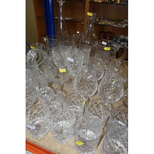 411 - A LARGE VARIETY OF CRYSTAL CUT DECANTERS, GLASSES, ETC, including two 'Royal Brierley' vases and a d... 