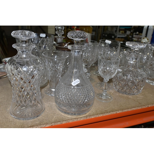 411 - A LARGE VARIETY OF CRYSTAL CUT DECANTERS, GLASSES, ETC, including two 'Royal Brierley' vases and a d... 