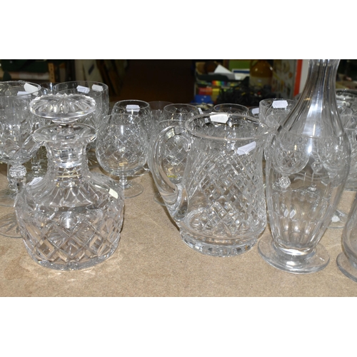 411 - A LARGE VARIETY OF CRYSTAL CUT DECANTERS, GLASSES, ETC, including two 'Royal Brierley' vases and a d... 