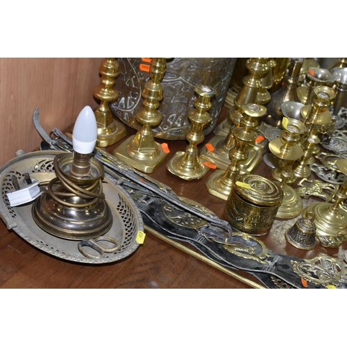 417 - A LARGE COLLECTION OF BRASSWARE INCLUDING SERVING TRAYS with Indo-Persian motifs, a large range of h... 