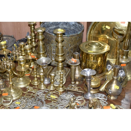 417 - A LARGE COLLECTION OF BRASSWARE INCLUDING SERVING TRAYS with Indo-Persian motifs, a large range of h... 