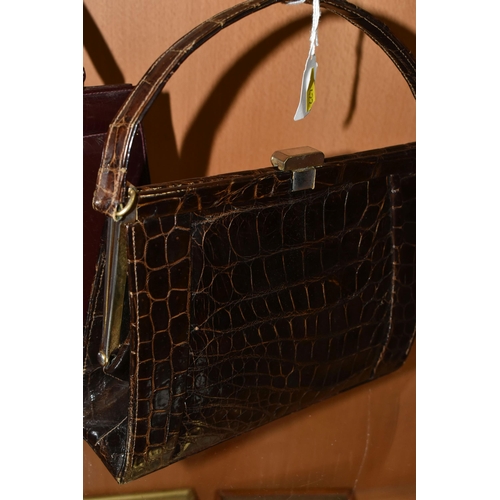 422 - THREE LADIES' VINTAGE HANDBAGS, comprising a brown French faux Croc bag, a claret patent leather col... 