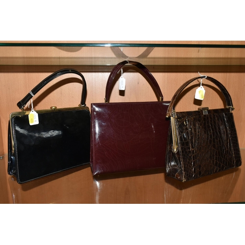 422 - THREE LADIES' VINTAGE HANDBAGS, comprising a brown French faux Croc bag, a claret patent leather col... 