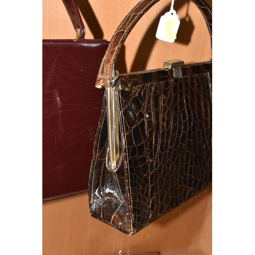 422 - THREE LADIES' VINTAGE HANDBAGS, comprising a brown French faux Croc bag, a claret patent leather col... 