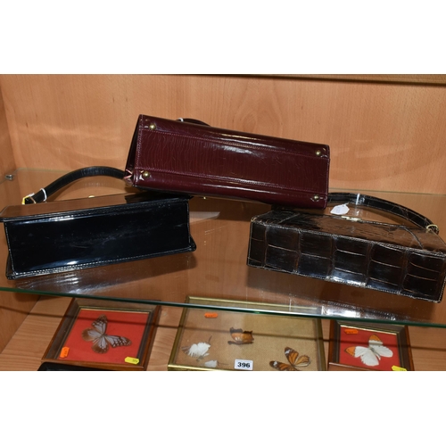 422 - THREE LADIES' VINTAGE HANDBAGS, comprising a brown French faux Croc bag, a claret patent leather col... 