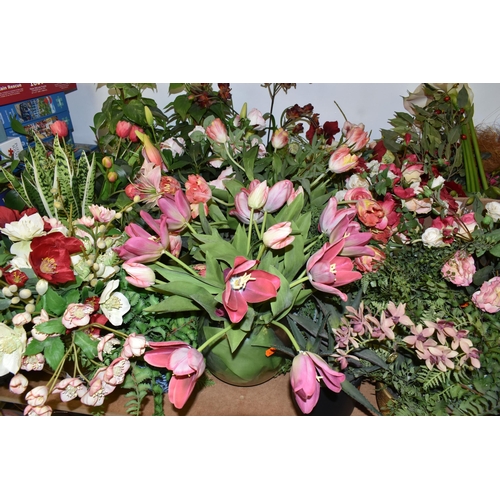 447 - A LARGE QUANITY OF ARTIFICIAL PLANTS IN CERAMIC AND GLASS VASES, approximately 20 faux flowers of va... 