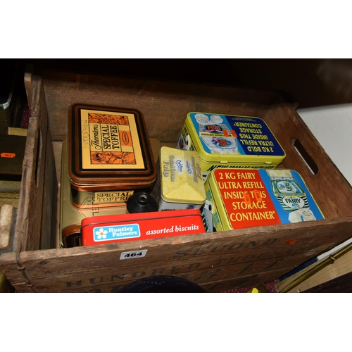 464 - TWO WOODEN CRATES AND LOOSE ADVERTISING TINS, FISHING RODS AND SUNDRY ITEMS, to include the lower tw... 