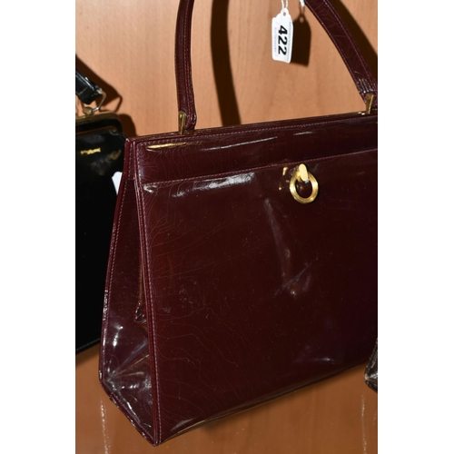 422 - THREE LADIES' VINTAGE HANDBAGS, comprising a brown French faux Croc bag, a claret patent leather col... 