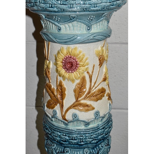 439 - A LARGE 19TH CENTURY BURMANTOFT FAIENCE JARDINIERE AND STAND, relief decorated panels of brown sunfl... 