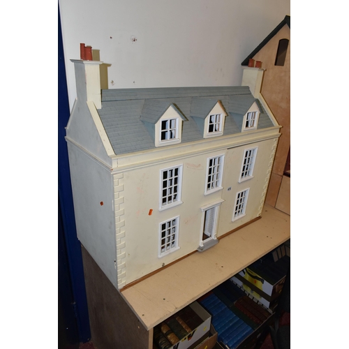 473 - A LARGE MODERN WOODEN DOLLS HOUSE, modelled as a Georgian townhouse, front opening to reveal four ro... 