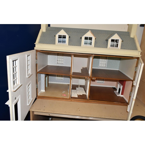 473 - A LARGE MODERN WOODEN DOLLS HOUSE, modelled as a Georgian townhouse, front opening to reveal four ro... 