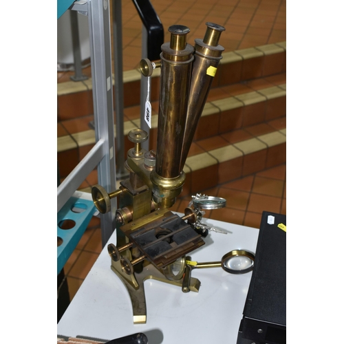 498 - A LARGE BRASS VICTORIAN MICROSCOPE AND OTHER OPTICAL EQUIPMENT, a large double eyepiece microscope i... 