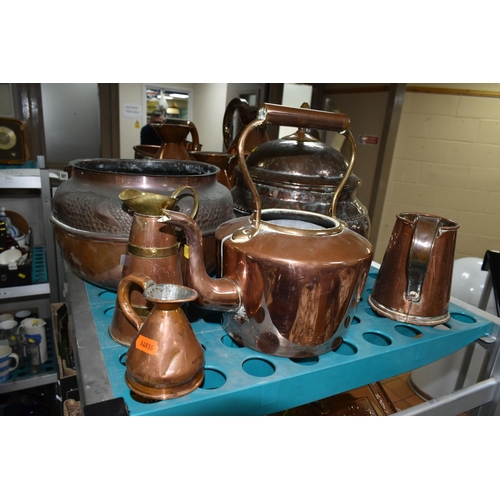 501 - A VARIETY OF COPPERWARE, comprising a selection of measuring vessels, tankards, an 'arts and crafts'... 