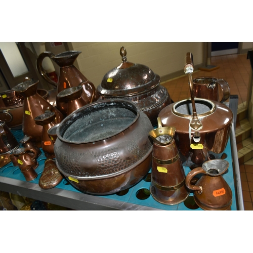 501 - A VARIETY OF COPPERWARE, comprising a selection of measuring vessels, tankards, an 'arts and crafts'... 