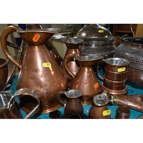 501 - A VARIETY OF COPPERWARE, comprising a selection of measuring vessels, tankards, an 'arts and crafts'... 