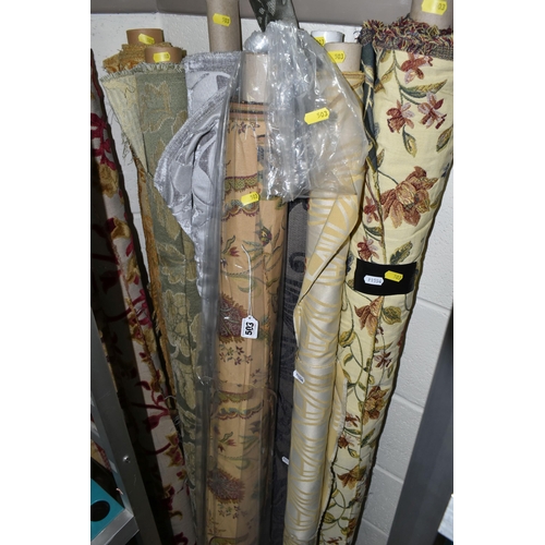 503 - ELEVEN ROLLS OF ASSORTED UPHOLSTERY AND CURTAIN FABRIC, mostly floral designs (s.d) (11 rolls)