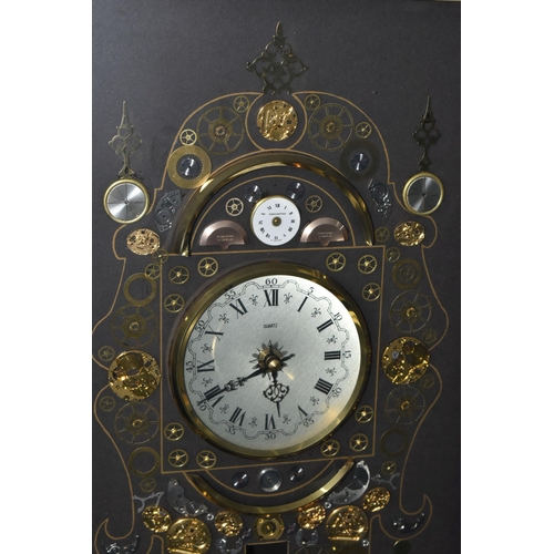 706 - A KEN BROADBENT CLOCK MONTAGE WITH QUARTZ MOVEMENT, in a gilt frame and glazed, overall height 69cm ... 