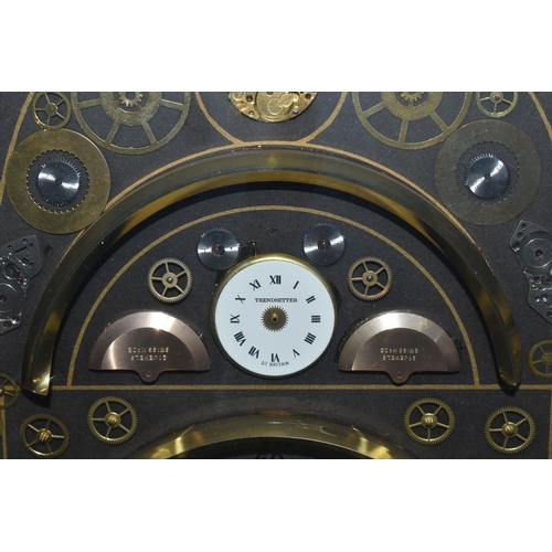 706 - A KEN BROADBENT CLOCK MONTAGE WITH QUARTZ MOVEMENT, in a gilt frame and glazed, overall height 69cm ... 