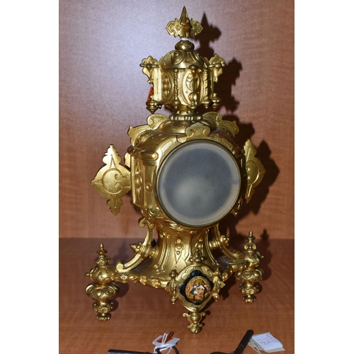 711 - A LATE 19TH CENTURY GILT METAL AND PORCELAIN MOUNTED MANTEL CLOCK, the porcelain dial with Roman num... 