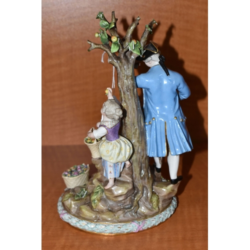 721 - A LATE 19TH CENTURY MEISSEN PORCELAIN FIGURE GROUP OF A COURTING COUPLE BENEATH A TREE WITH FLOWERS,... 