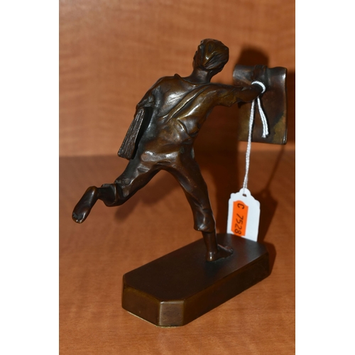 735 - A 1930'S POLITAL INTEREST BRONZE FIGURE OF A BARE FOOTED NEWSPAPER BOY POSED AS RUNNING, with a news... 