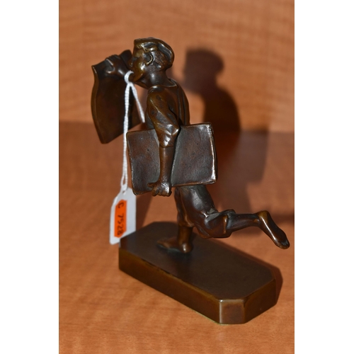 735 - A 1930'S POLITAL INTEREST BRONZE FIGURE OF A BARE FOOTED NEWSPAPER BOY POSED AS RUNNING, with a news... 