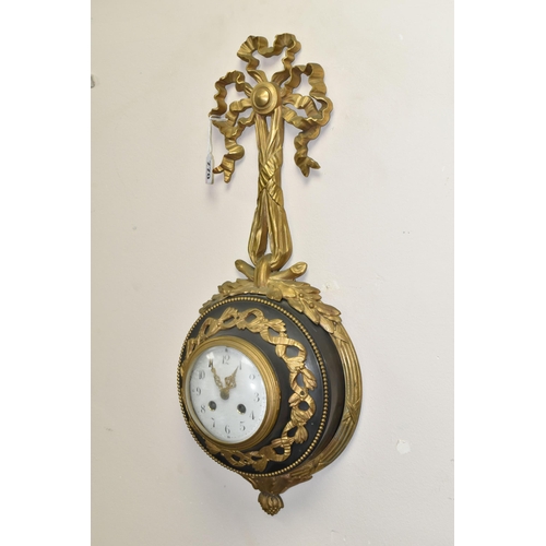 770 - A LATE 19TH / EARLY 20TH CENTURY CARTEL CLOCK BY SAMUEL MARTI, cast gilt metal ribbon and wreath cas... 