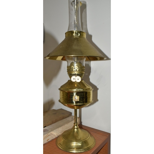 775 - A MODERN BRASS OIL LAMP OF EARLY 20TH CENTURY STYLE, bears Pullman emblem to the reservoir, on an ad... 