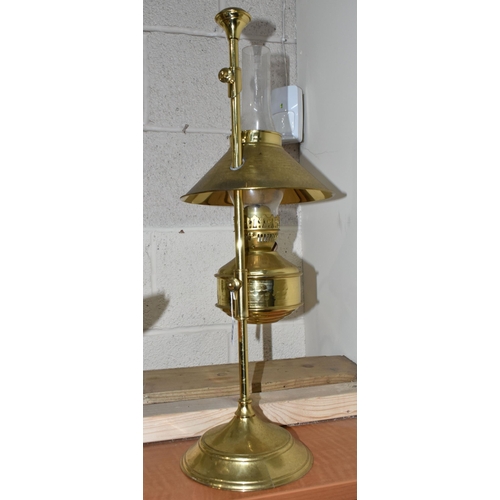 775 - A MODERN BRASS OIL LAMP OF EARLY 20TH CENTURY STYLE, bears Pullman emblem to the reservoir, on an ad... 