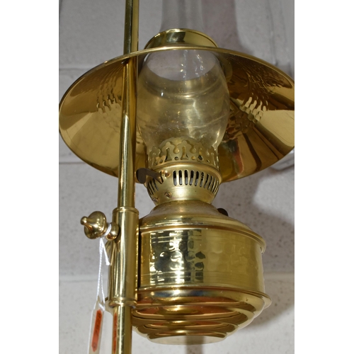 775 - A MODERN BRASS OIL LAMP OF EARLY 20TH CENTURY STYLE, bears Pullman emblem to the reservoir, on an ad... 