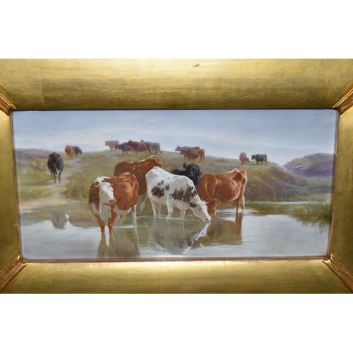 778 - A LATE 19TH CENTURY GILT FRAMED PORCELAIN PLAQUE PAINTED WITH CATTLE WATERING, unsigned and unmarked... 