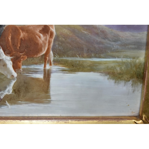 778 - A LATE 19TH CENTURY GILT FRAMED PORCELAIN PLAQUE PAINTED WITH CATTLE WATERING, unsigned and unmarked... 