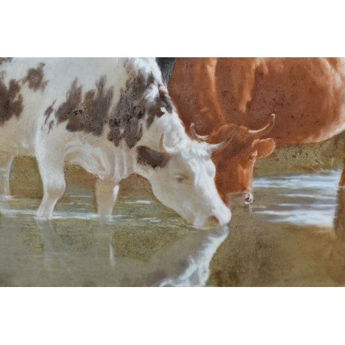 778 - A LATE 19TH CENTURY GILT FRAMED PORCELAIN PLAQUE PAINTED WITH CATTLE WATERING, unsigned and unmarked... 