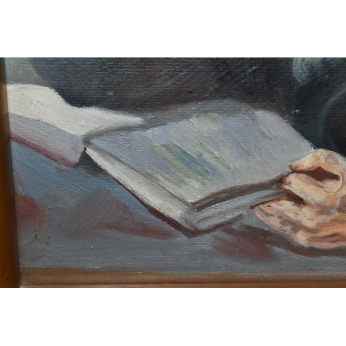 783 - A MID 20TH CENTURY PORTRAIT OF A RABBI, a seated Rabbi is reading from a book, his glasses are perch... 