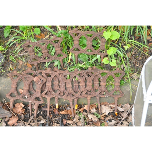 1015 - A COLLECTION OF CAST IRON GARDEN ITEMS including seven Victorian lawn edgers, a modern table top, tw... 