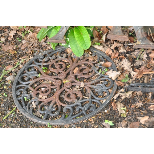 1015 - A COLLECTION OF CAST IRON GARDEN ITEMS including seven Victorian lawn edgers, a modern table top, tw... 