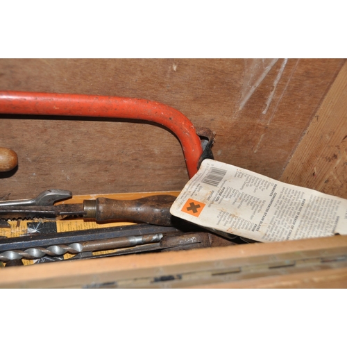 1052 - A VINTAGE CARPENTERS TOOLCHEST with drop down half front concealing one internal drawer and containi... 