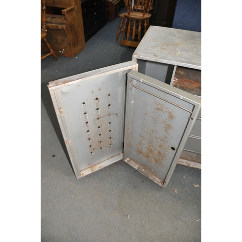 1086 - A VINTAGE STEEL WORKSHOP CABINET with two doors concealing three internal drawers and a hinged inner... 