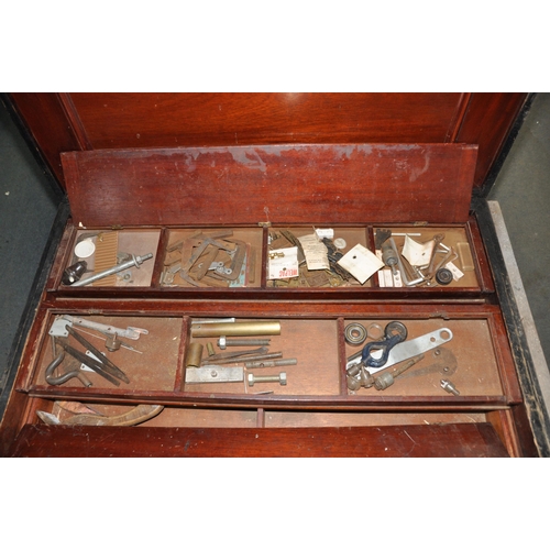 1089 - A LARGE VINTAGE CARPENTERS TOOLBOX with a pine outer carcass, steel banding, mahogany top, interior ... 