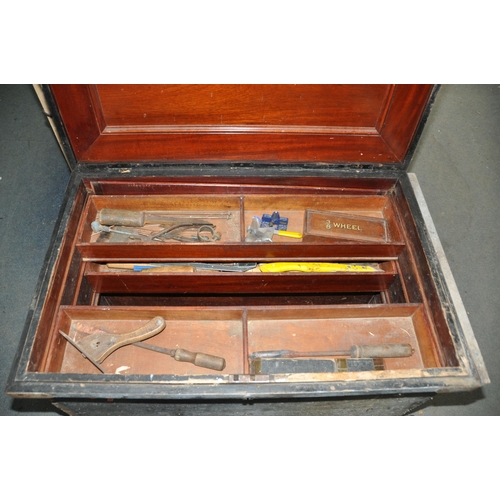 1089 - A LARGE VINTAGE CARPENTERS TOOLBOX with a pine outer carcass, steel banding, mahogany top, interior ... 