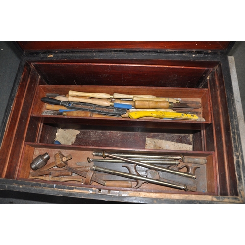 1089 - A LARGE VINTAGE CARPENTERS TOOLBOX with a pine outer carcass, steel banding, mahogany top, interior ... 