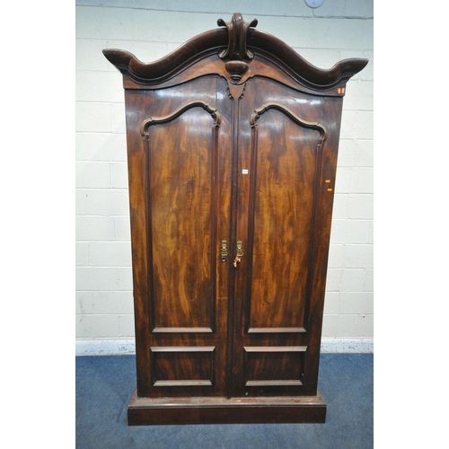 1277 - A VICTORIAN FLAME MAHOGANY LINEN PRESS, with an arched top, the full length double doors enclosing f... 