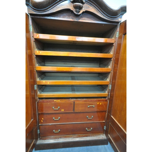 1277 - A VICTORIAN FLAME MAHOGANY LINEN PRESS, with an arched top, the full length double doors enclosing f... 