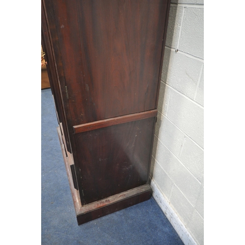 1277 - A VICTORIAN FLAME MAHOGANY LINEN PRESS, with an arched top, the full length double doors enclosing f... 