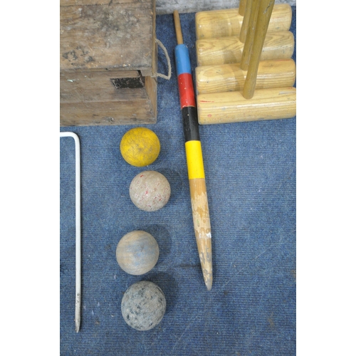 1278 - QUAIFE AND LILLEY LTD, A VINTAGE CROQUET SET, comprising four mallets, four balls, six hoops, one ce... 